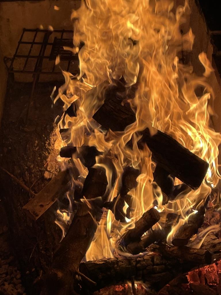 A fire burning in a fire pit

AI-generated content may be incorrect.