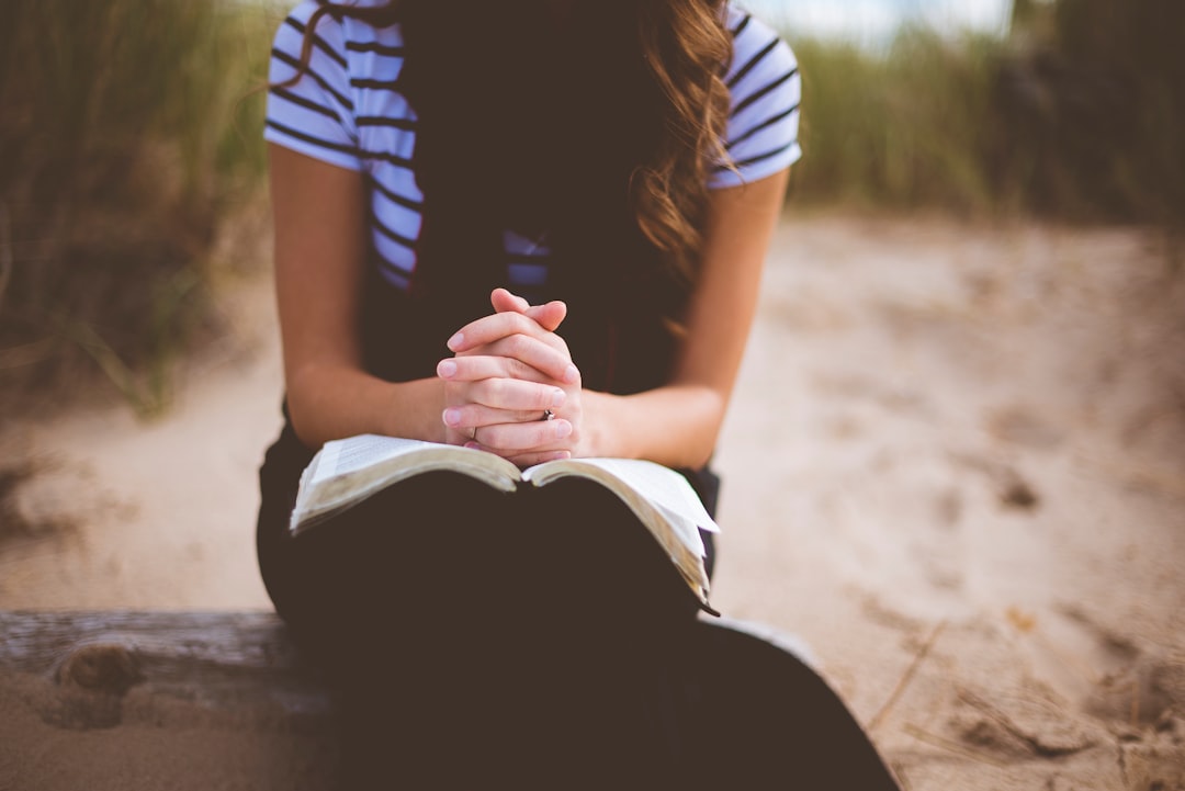 Person kneeling in prayer