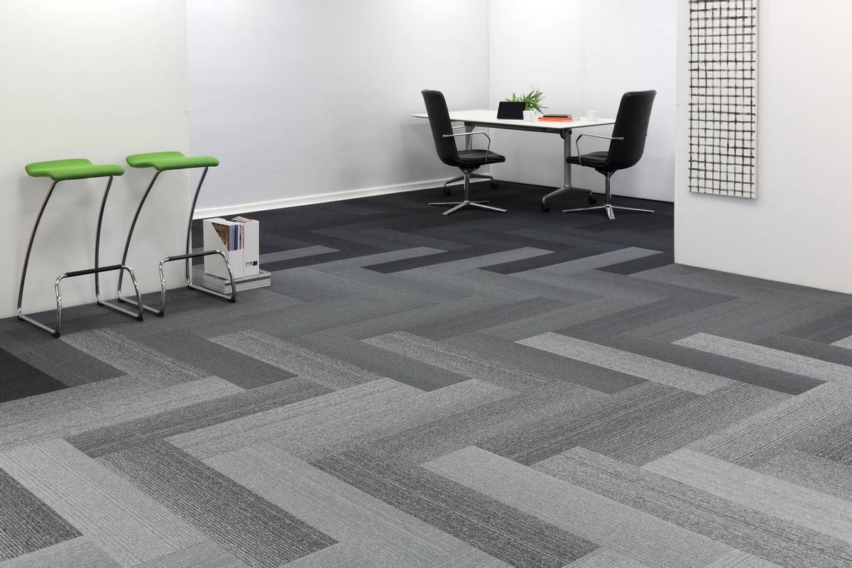 An image of a work space with carpet flooring