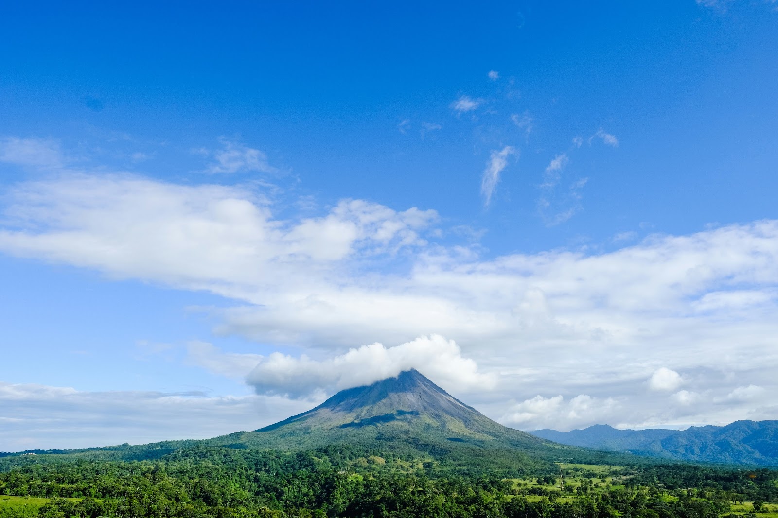 Hot springs in La Fortuna with the Arenal Volcano in the background.