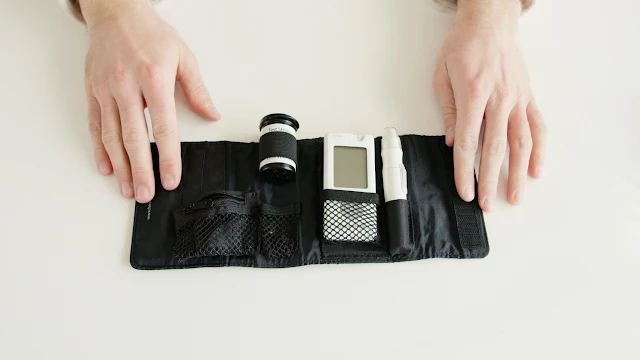 hands holding blood pressure device
