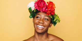 woman smiling wearing flower crown