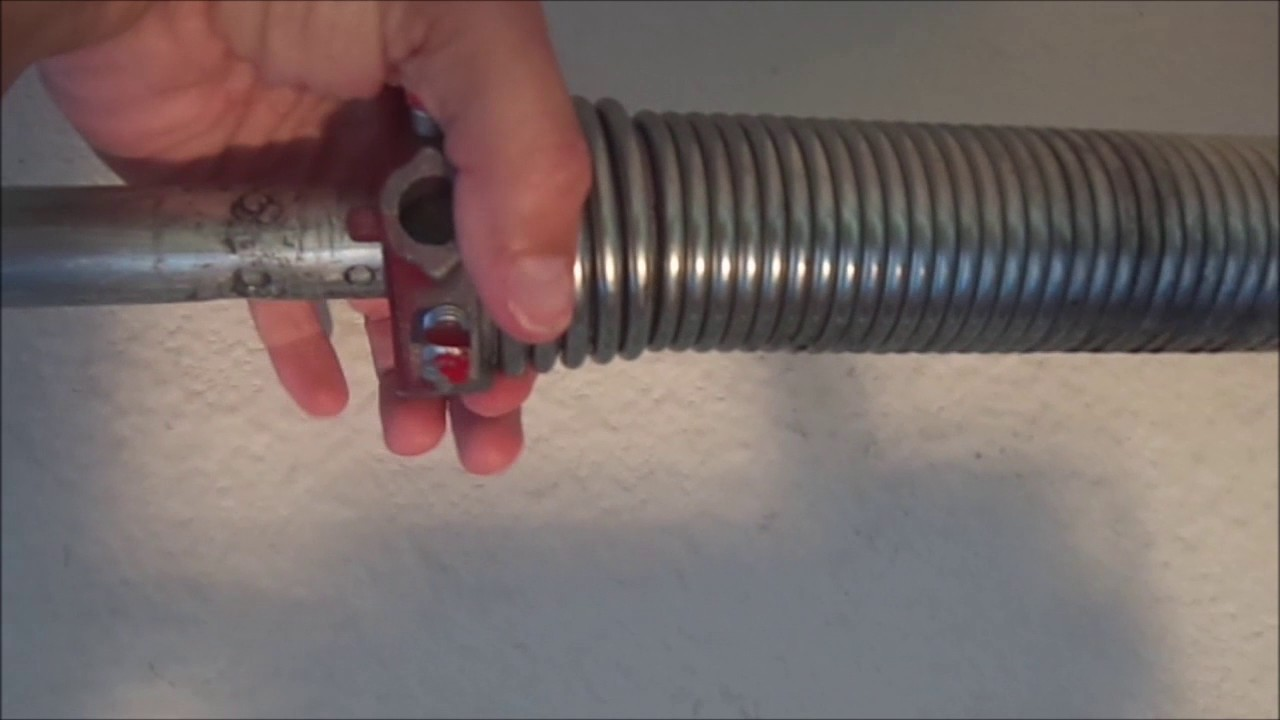 how to adjust garage door torsion springs