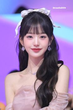 A picture of Wonyoung on a peach gown 