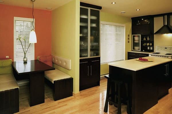 Dining area with a rectangular dining set and a dark wood console table topped with a framed portrait.