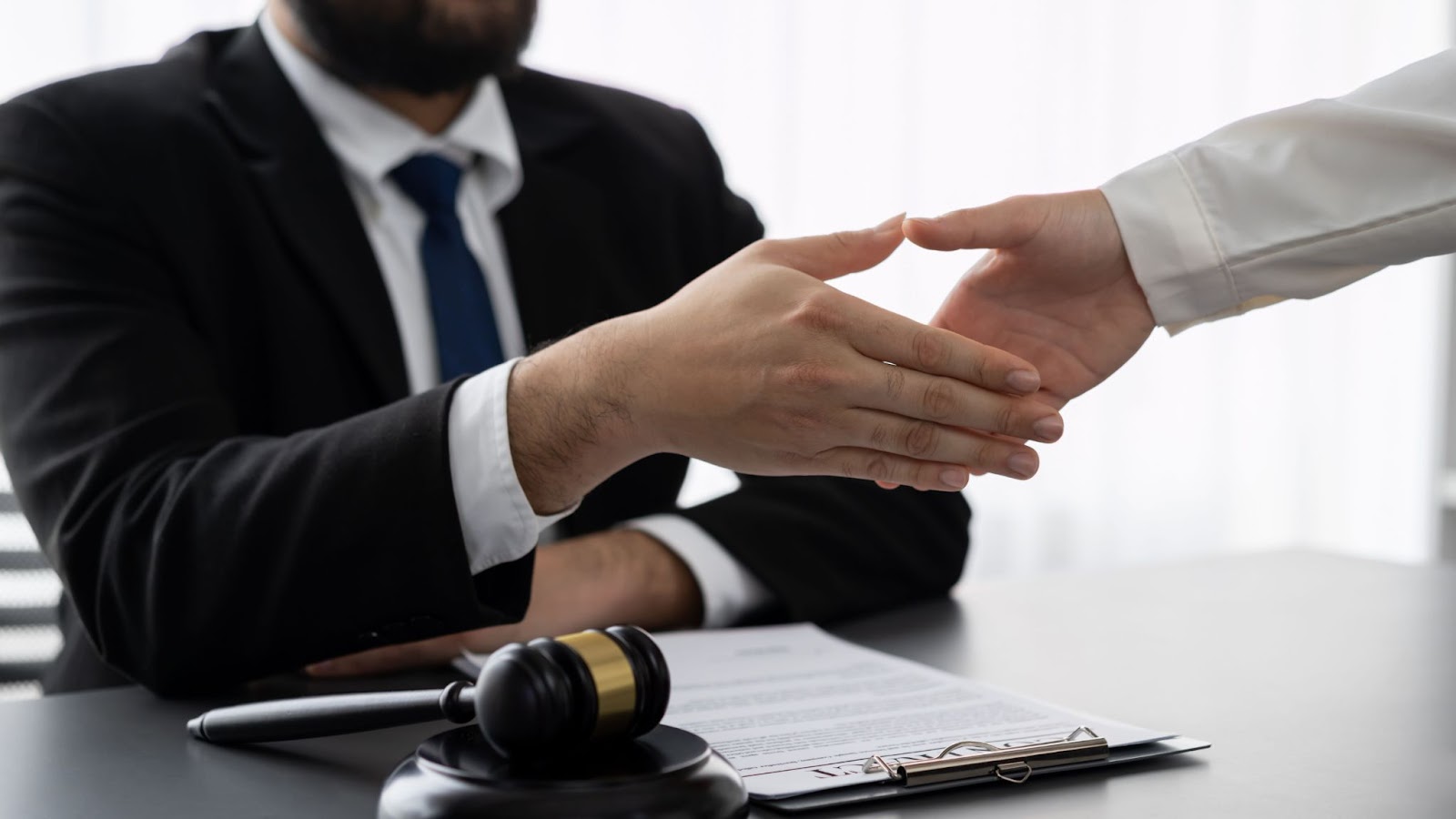 man shaking hands with a judge