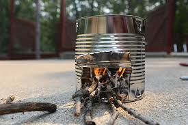 A tin can designed  into a stove used as emergency cooking Hacks When camping