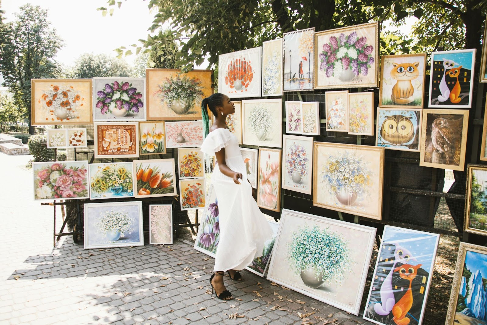 https://www.pexels.com/photo/woman-looking-on-flower-painting-1321552/