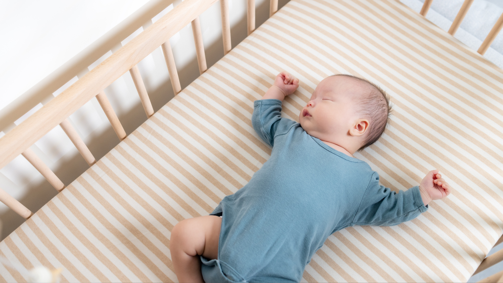 Safe crib setup with firm mattress and no blankets or toys.