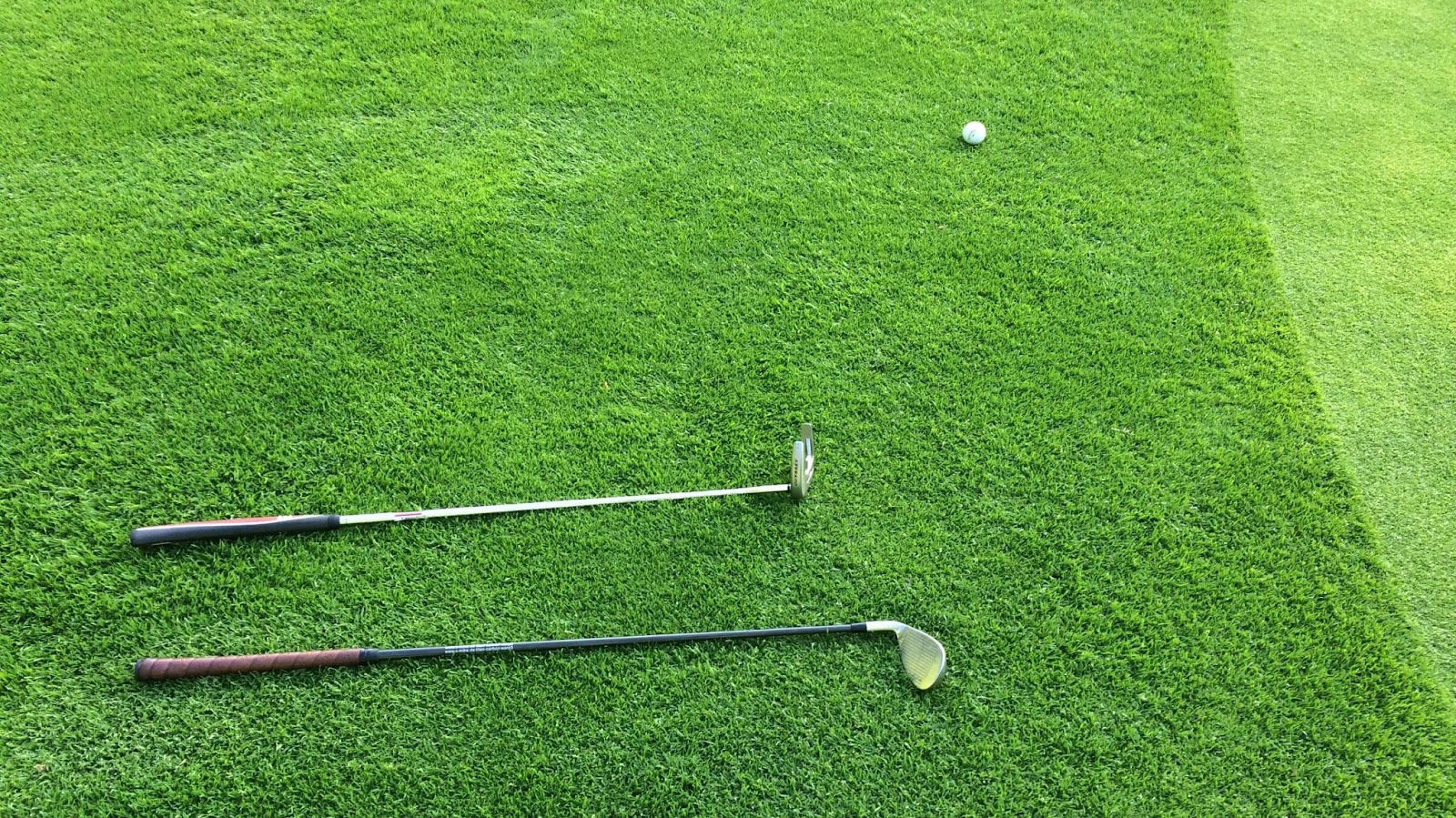 golf clubs on green 