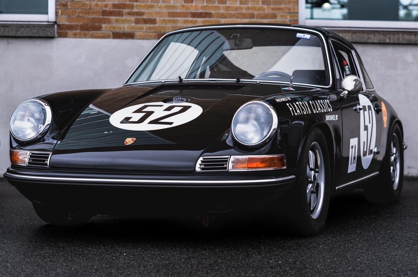 A black sports car with a white number on the front

AI-generated content may be incorrect.