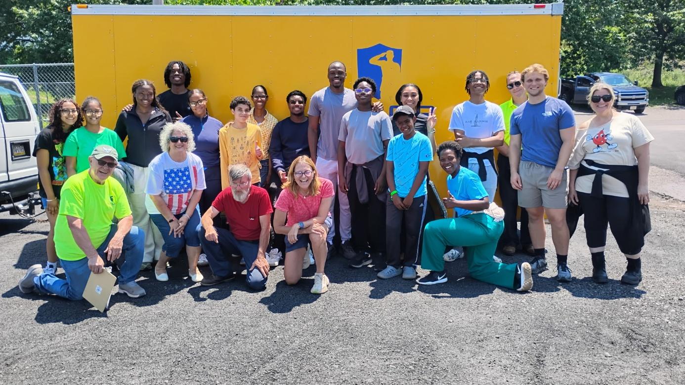 A group of people posing for a photo

AI-generated content may be incorrect.