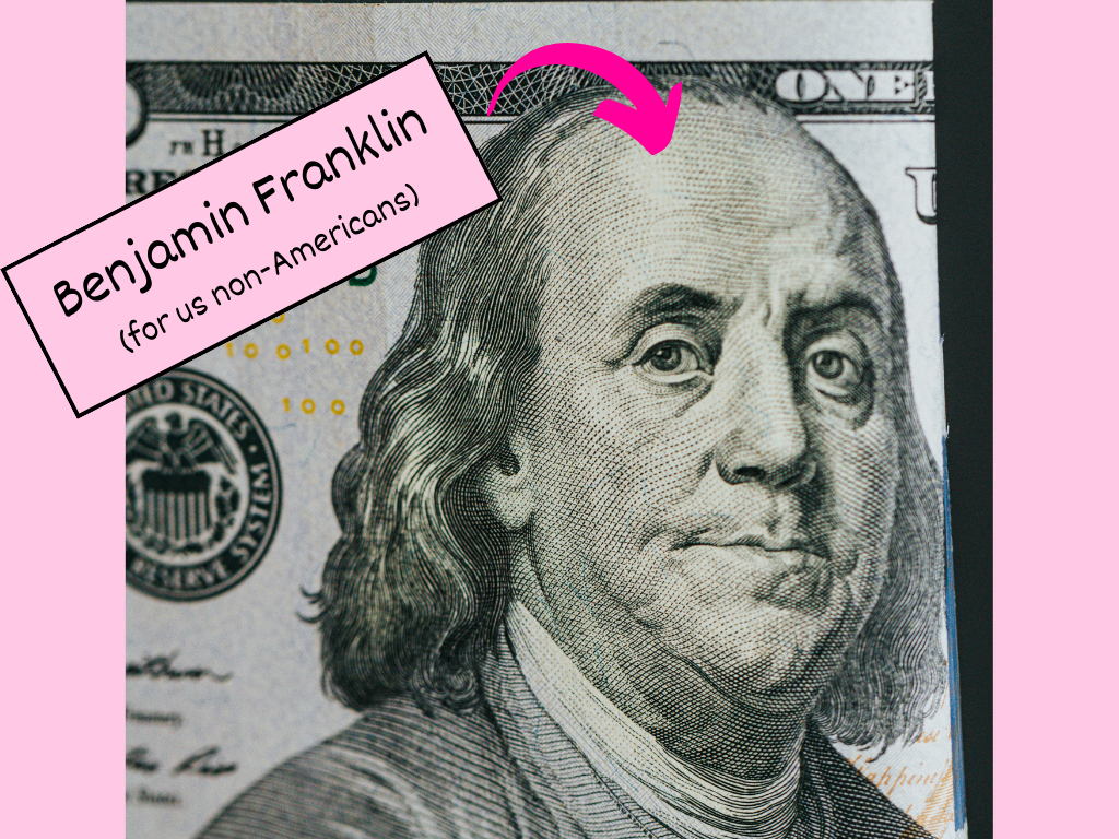 A decorative photo of USD money with Ben Franklin's face.