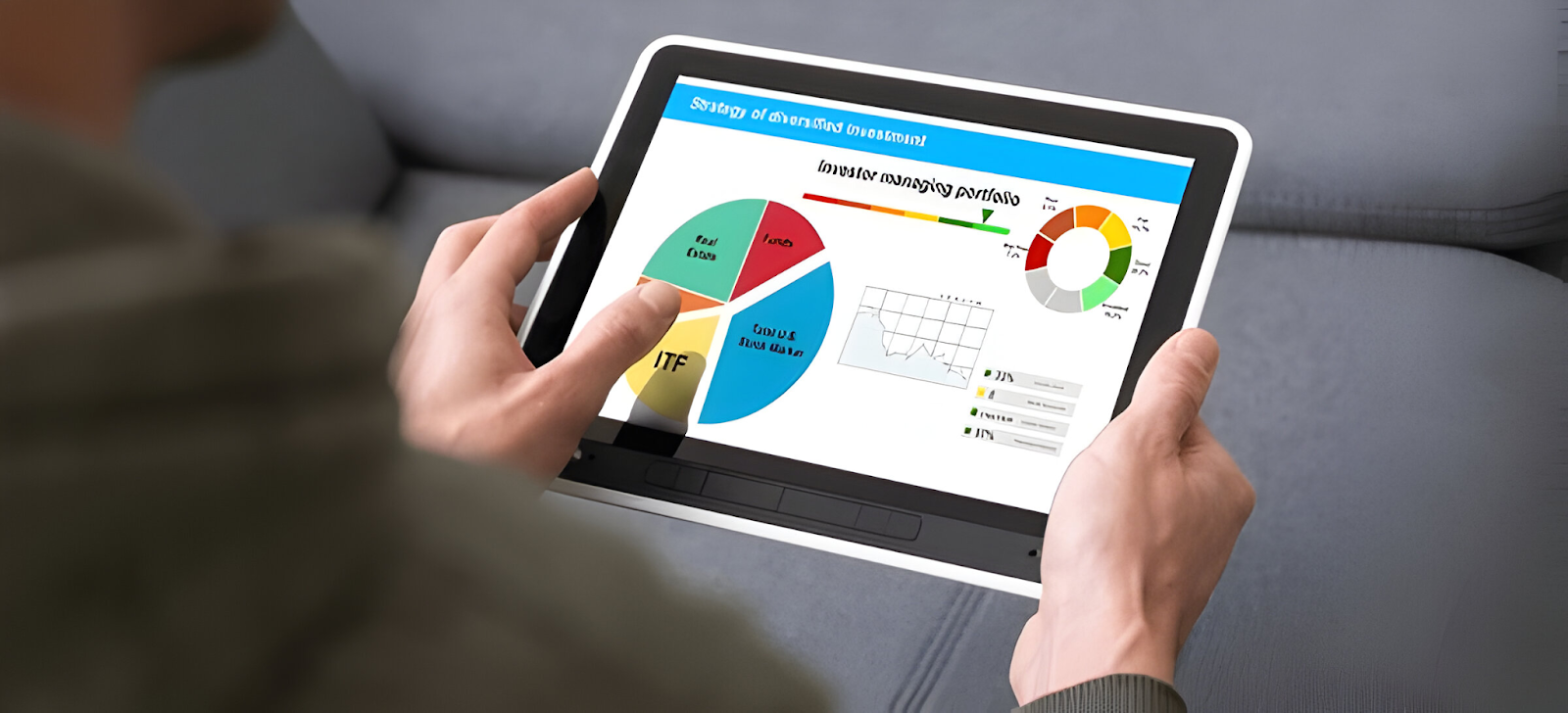 Person analyzing investment portfolio charts and pie graphs on a tablet, illustrating strategic financial planning and decision-making.