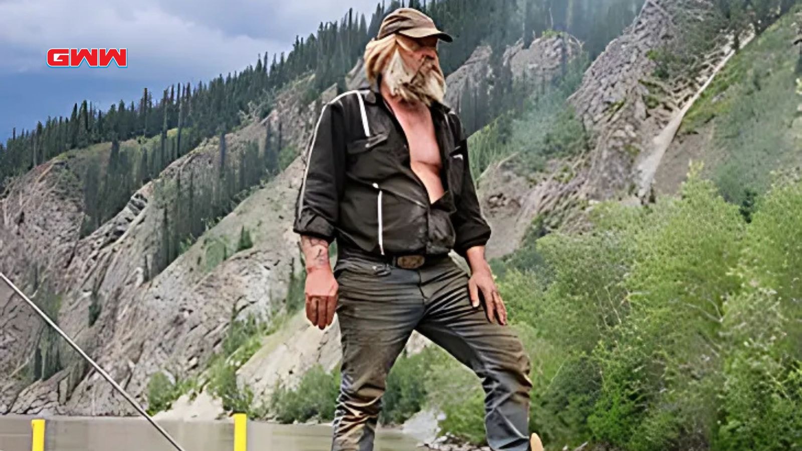 Gold Rush veteran Tony Beets observing the mining site in the mountains