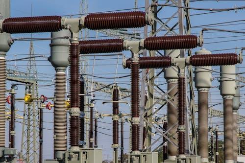 Free Detailed view of high voltage electrical substation with transformers and power lines. Stock Photo