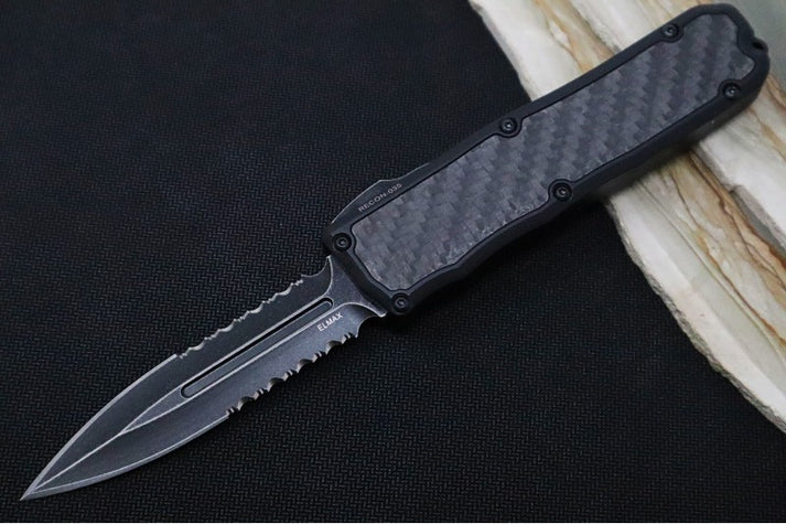 An image featuring the Guardian Tactical RECON-035 with black aluminum handle and carbon fiber inlay. The knife features a partially serrated, dark stonewashed dagger blade.