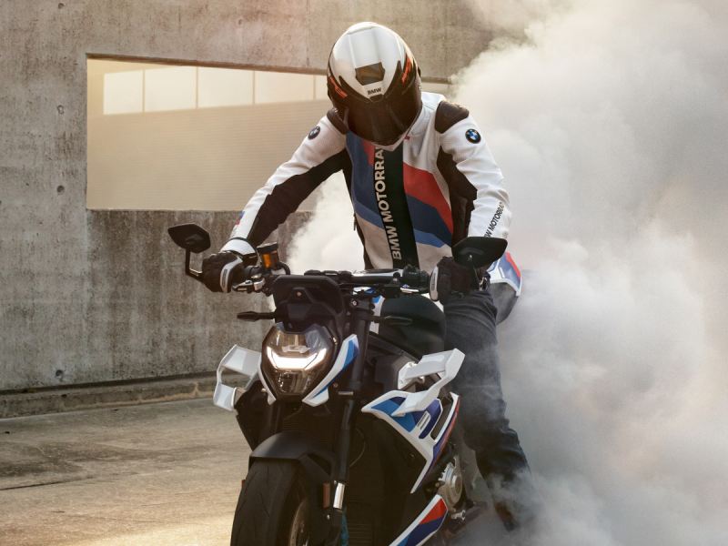 a rider on a BMW motorcycle, equipped with a Motorsport motorcycle outfit