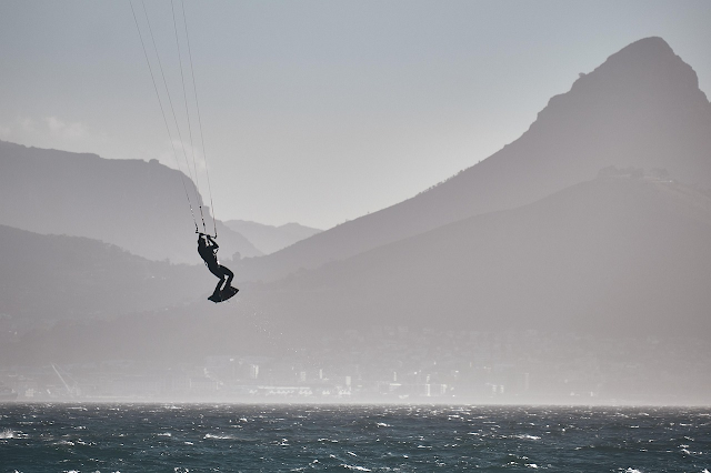 man at sunset wake boarding