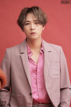 This contains a picture of FTISLAND's Lee Hongki  in a suit and pink shirt