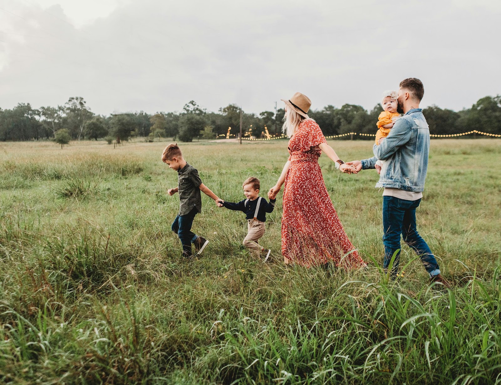 A family walking in the fields | Source: Unsplash