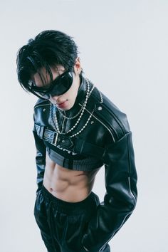 This  contain an mage of KIRE   in black leather jacket and chain around his waist with sunglasses on