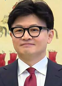 This contains an image of Han Dong Hoon