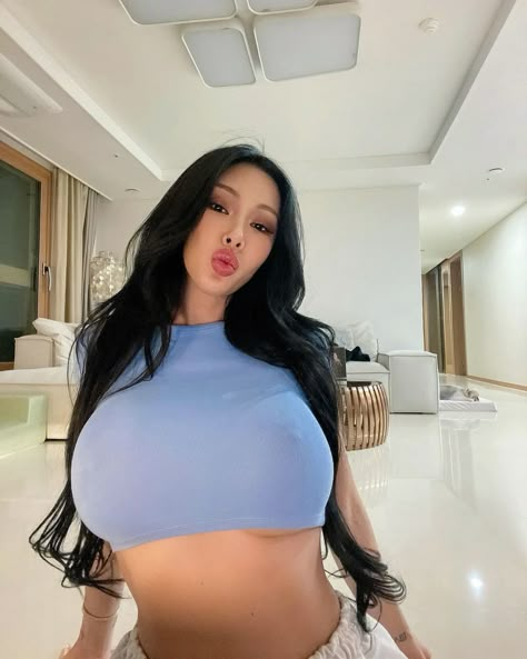 A picture of jessi wearing a sky blue crop top 