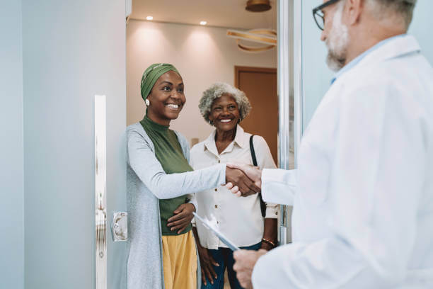 A cancer patient with a doctor, after discussing nutrition and the role of sugar in cancer treatment.