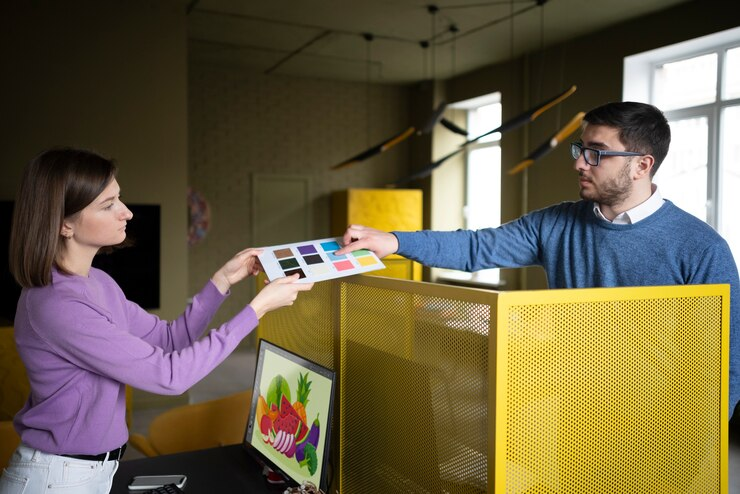 A couple choosing their designs to print.