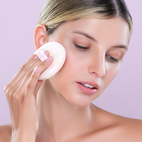 Applying loose powder to set soft glam makeup look-  Charmacy Milano