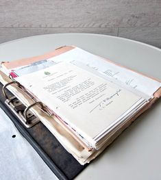 A picture of compiled documents on a table 