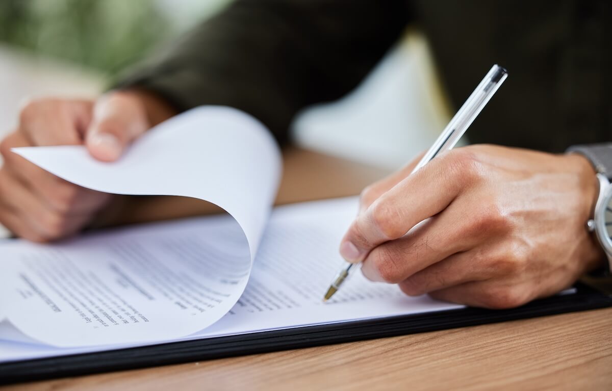Onboarding documents: person reading through a contract