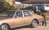 A person standing next to a car

AI-generated content may be incorrect.