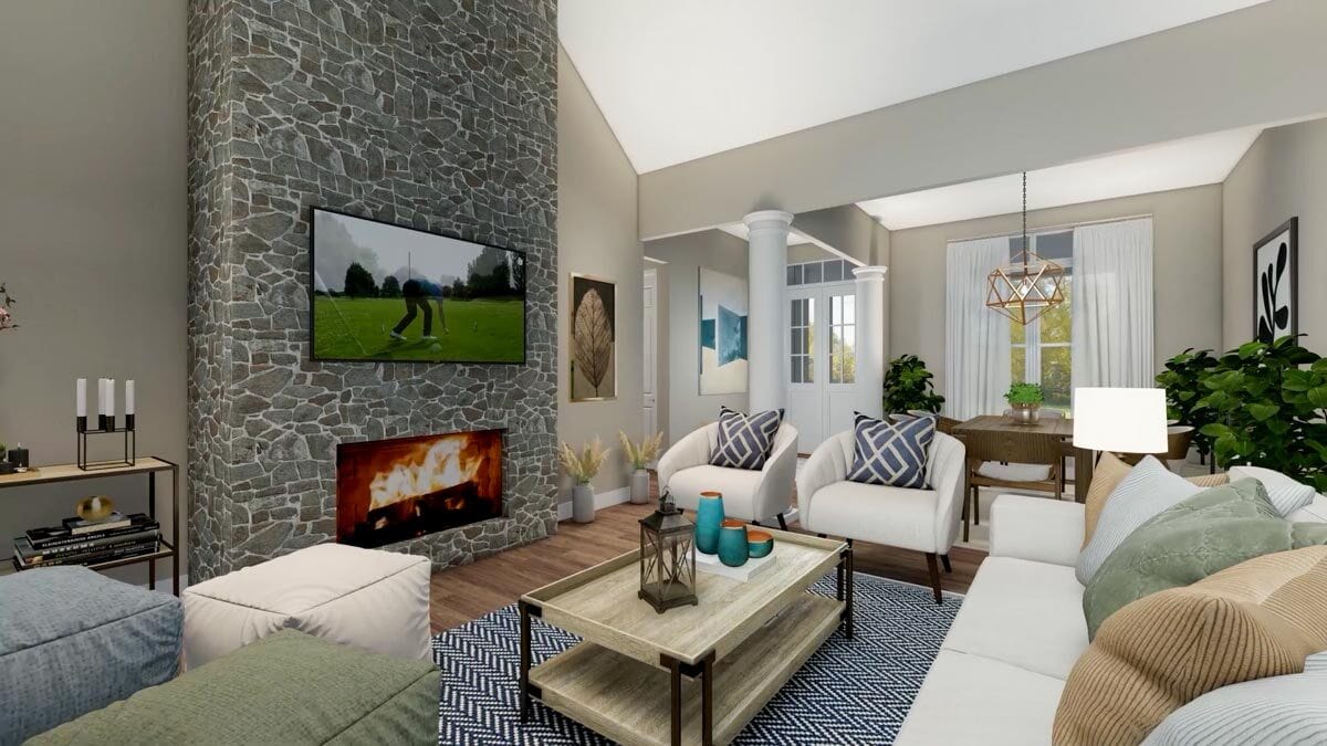 An alternate interior of the living room showcasing a large stone fireplace topped with a large TV.