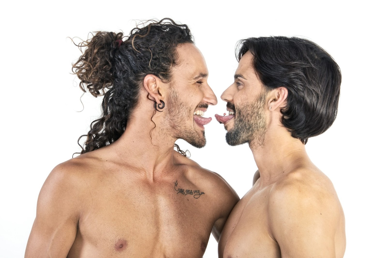 Two men holding their tongues out.