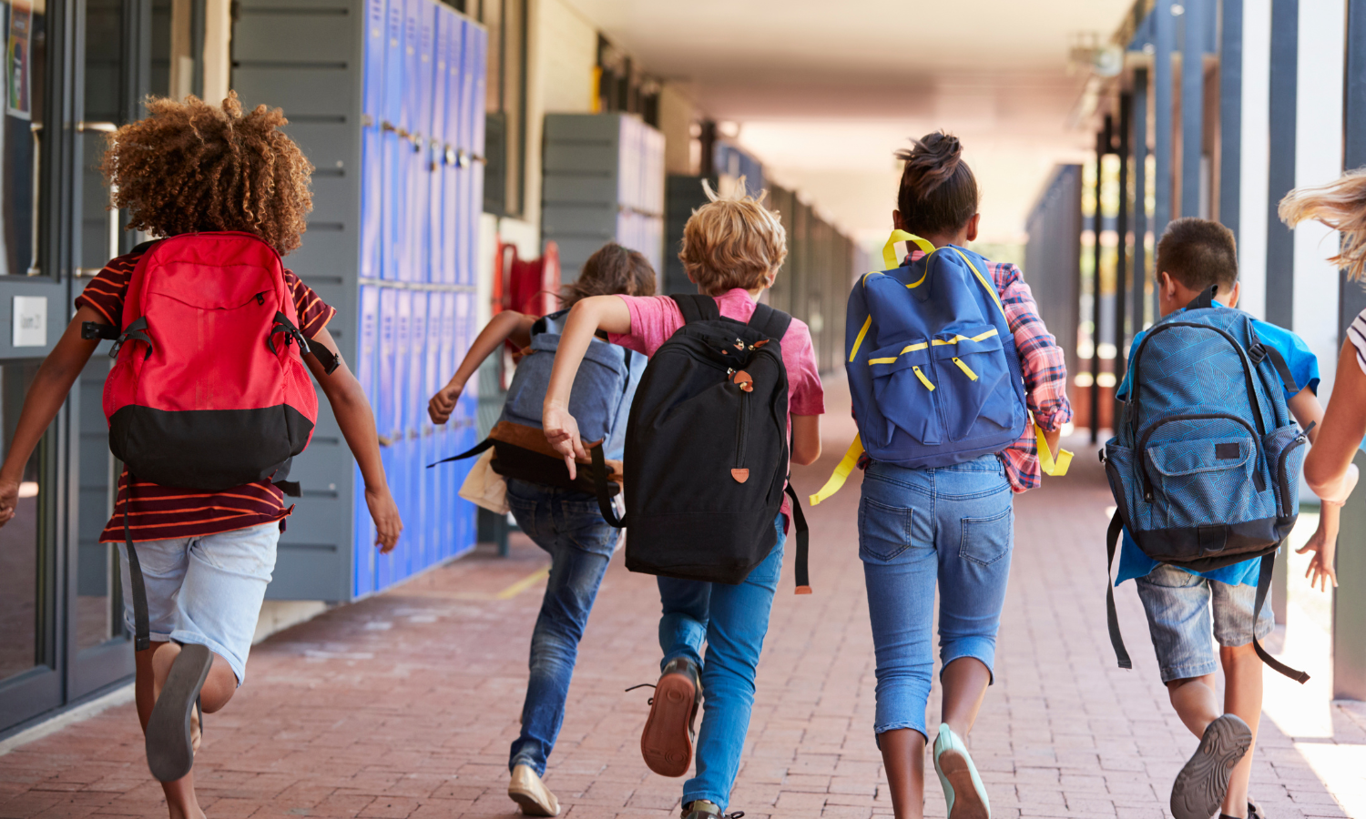K12 children running through the hallway