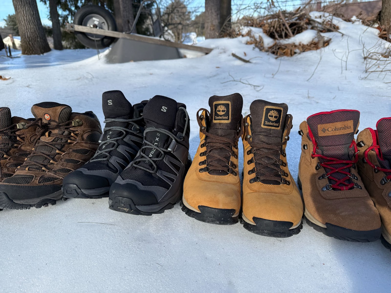 Front View Of the Mt Maddsen Salomon X Ultr 4 Mid GTX and Merrell Moab In the snow, illustrating options for hikers