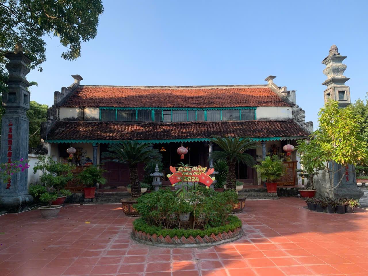 A building with a red tile floorDescription automatically generated