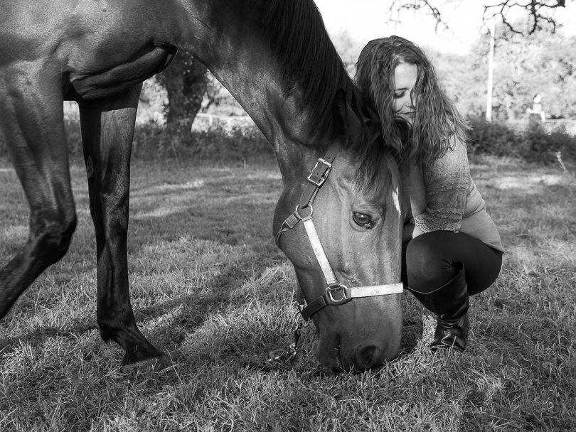 Made in the Stars, a Heart Horse Story, Scout, a bay Dutch Warmblood gelding and Julie Bradshaw in black and white.  Photo taken by artist Stacey Lizette