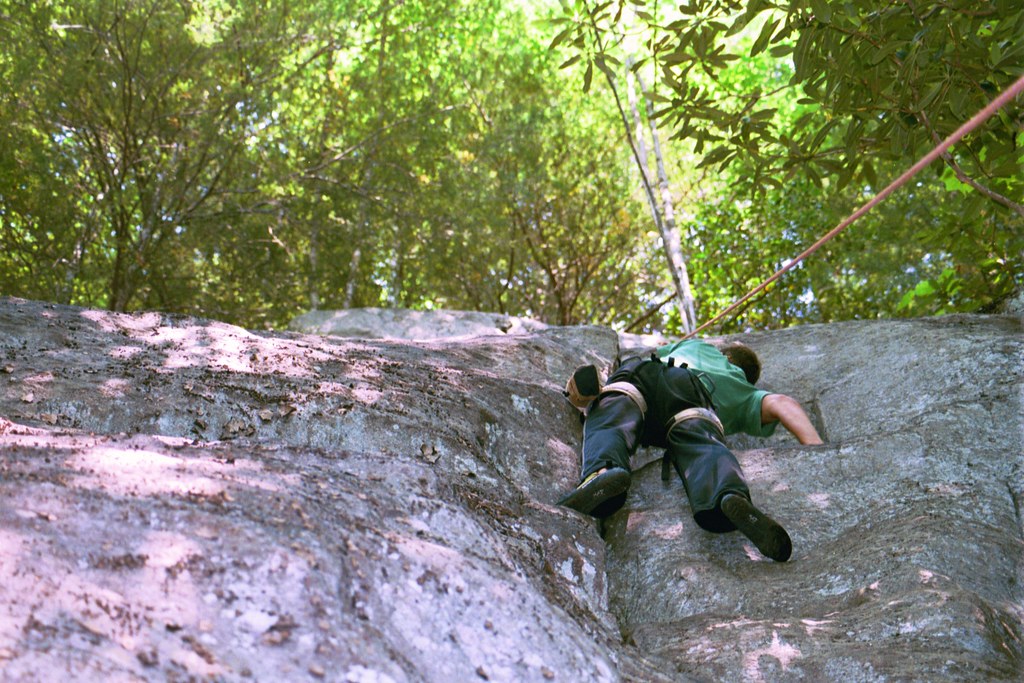 A man rock climbing on Chimney Rock.