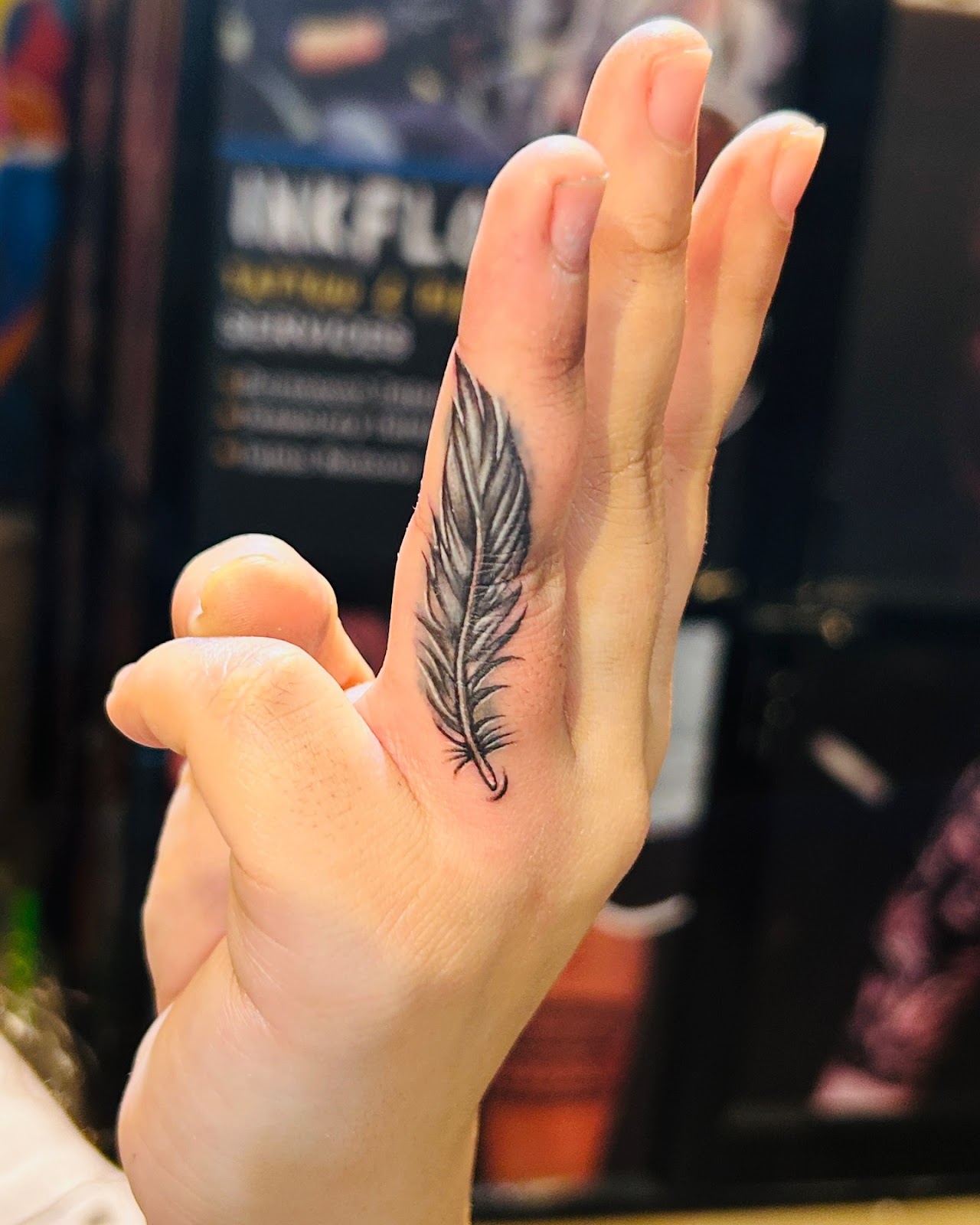 Feather Finger Tattoo
