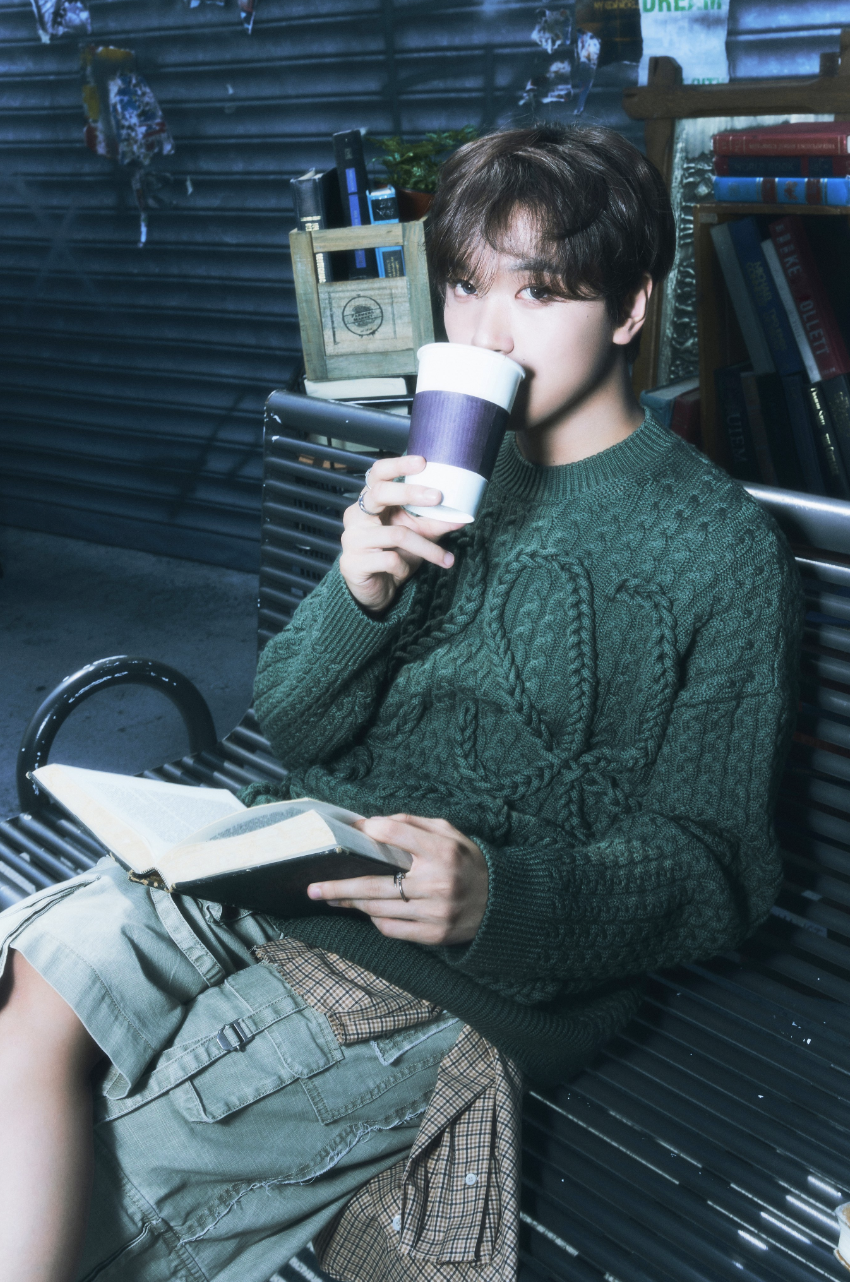 A picture of NCT Haechan recent look wearing a green wooden sweater 