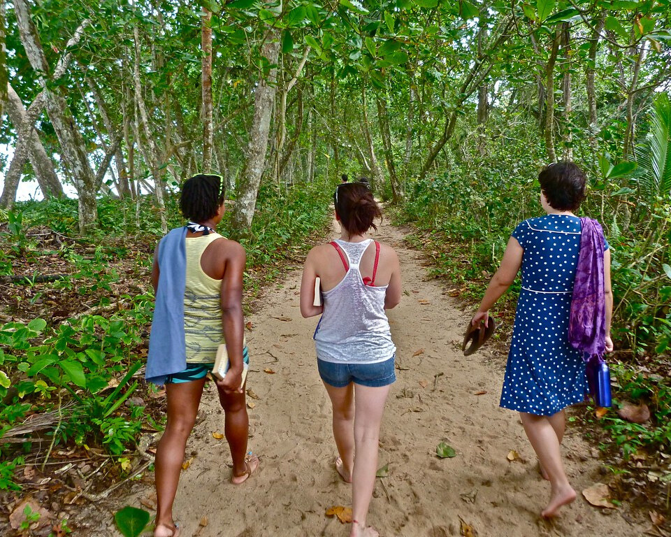 Three women on a trail in Cahuita National Park.