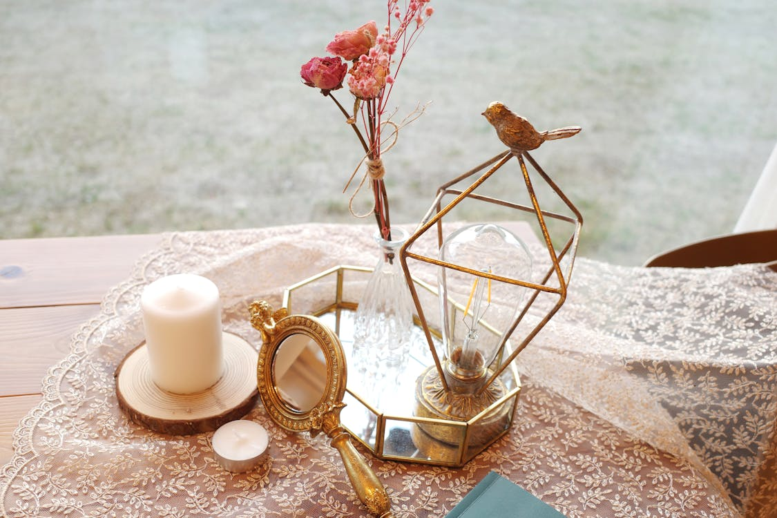 rose and gold centerpiece with a glass tray