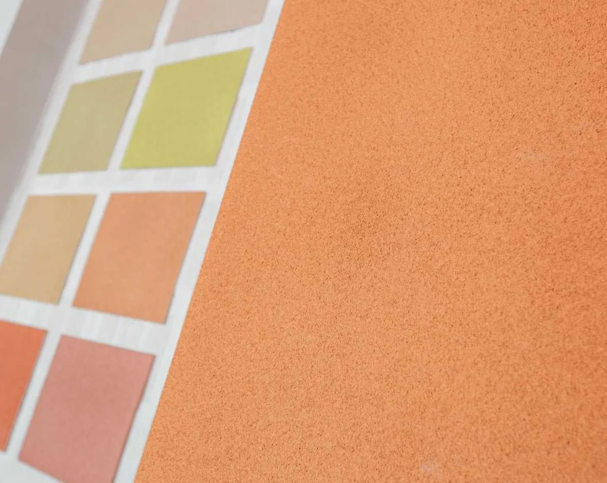 A close-up of a sample board of cork-based paint colors.