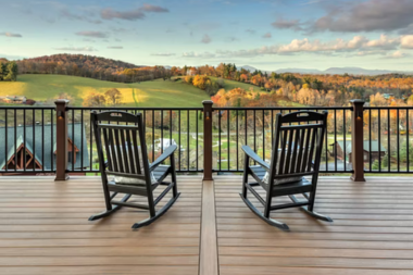 environmental benefits of choosing trex composite decking rocking chairs overlooking forest view custom built michigan