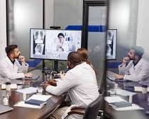 Image of Diverse team collaborating remotely via video conference