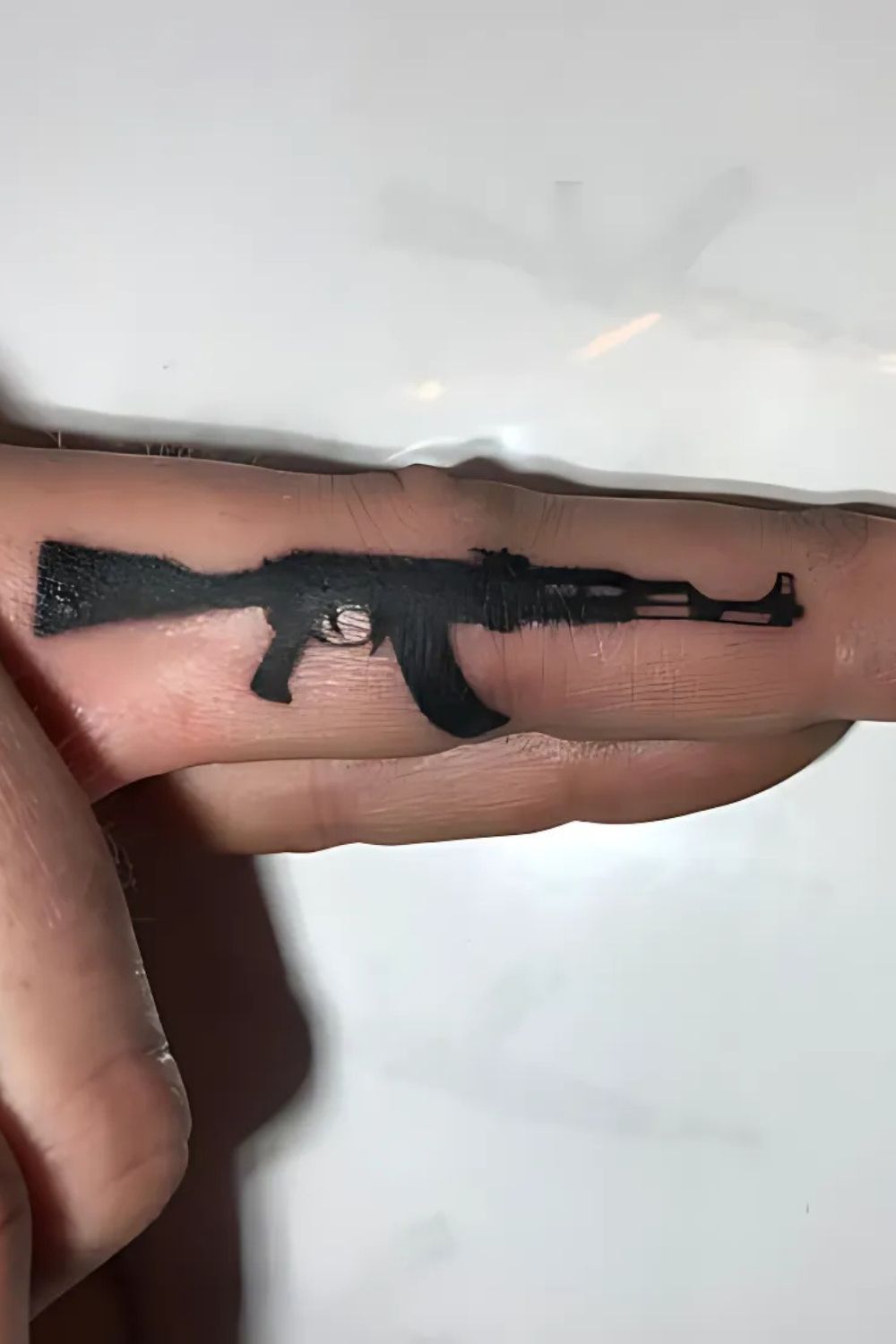 Gun Finger Tattoo