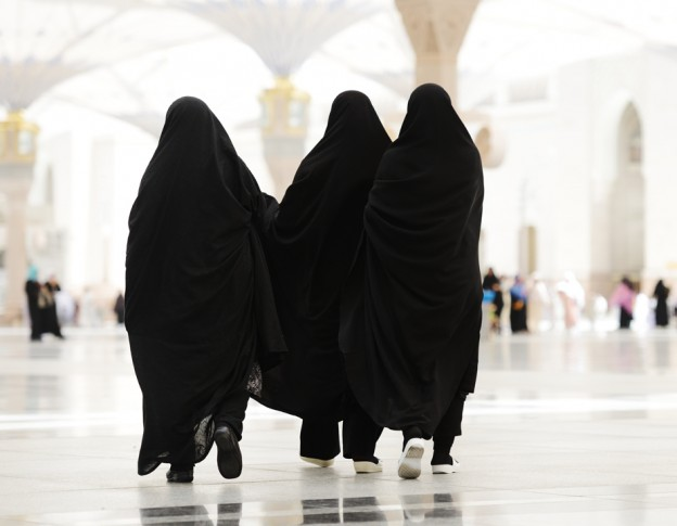 Three women walking inside a mosque on their Umrah trip - (Credits Al Khalid Tours & Travels)